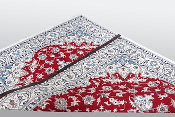A carpet, Nain, part silk, ca 238 x 170 cm.
