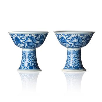 967. A pair of blue and white 'eight immortals' stemcups, Qing dynasty with Daoguang mark and of the period.