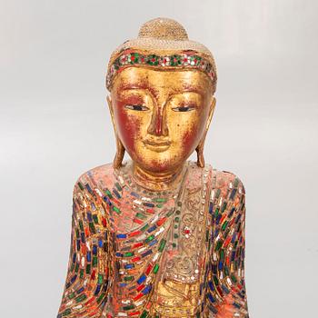 A gilde wooden Buddha first half of the 20th century.
