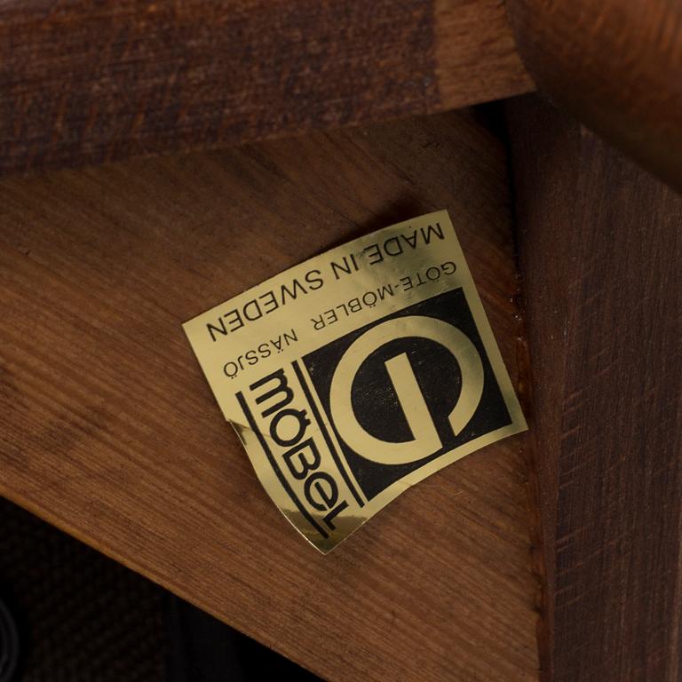 A pair of stained beech and leather easy chairs from Göte Möbler, Nässjö, second half of the 20th century.