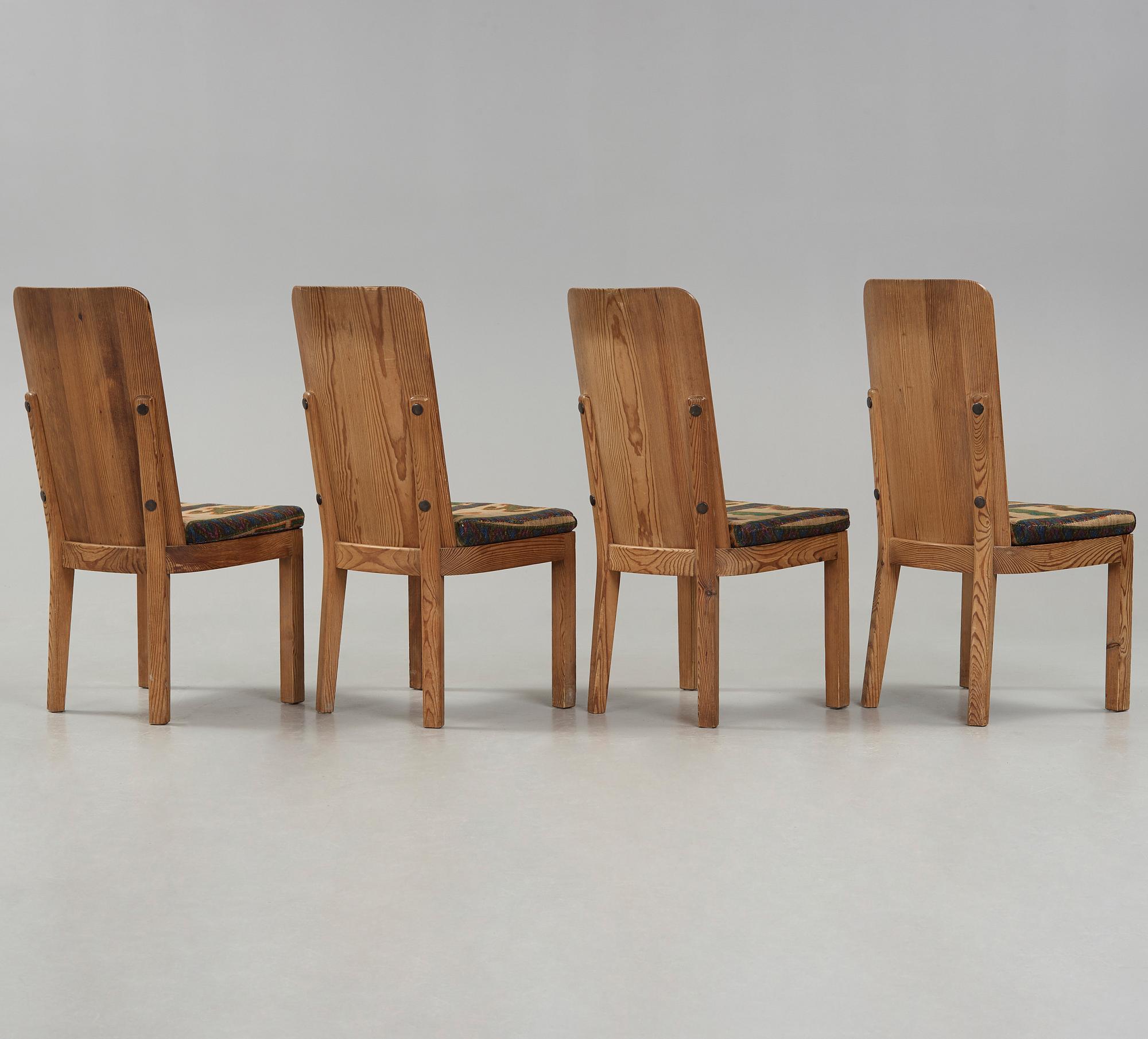 A set of four Axel Einar Hjorth 'Lovö' stained pine chairs, Nordiska Kompaniet, Sweden 1930's.