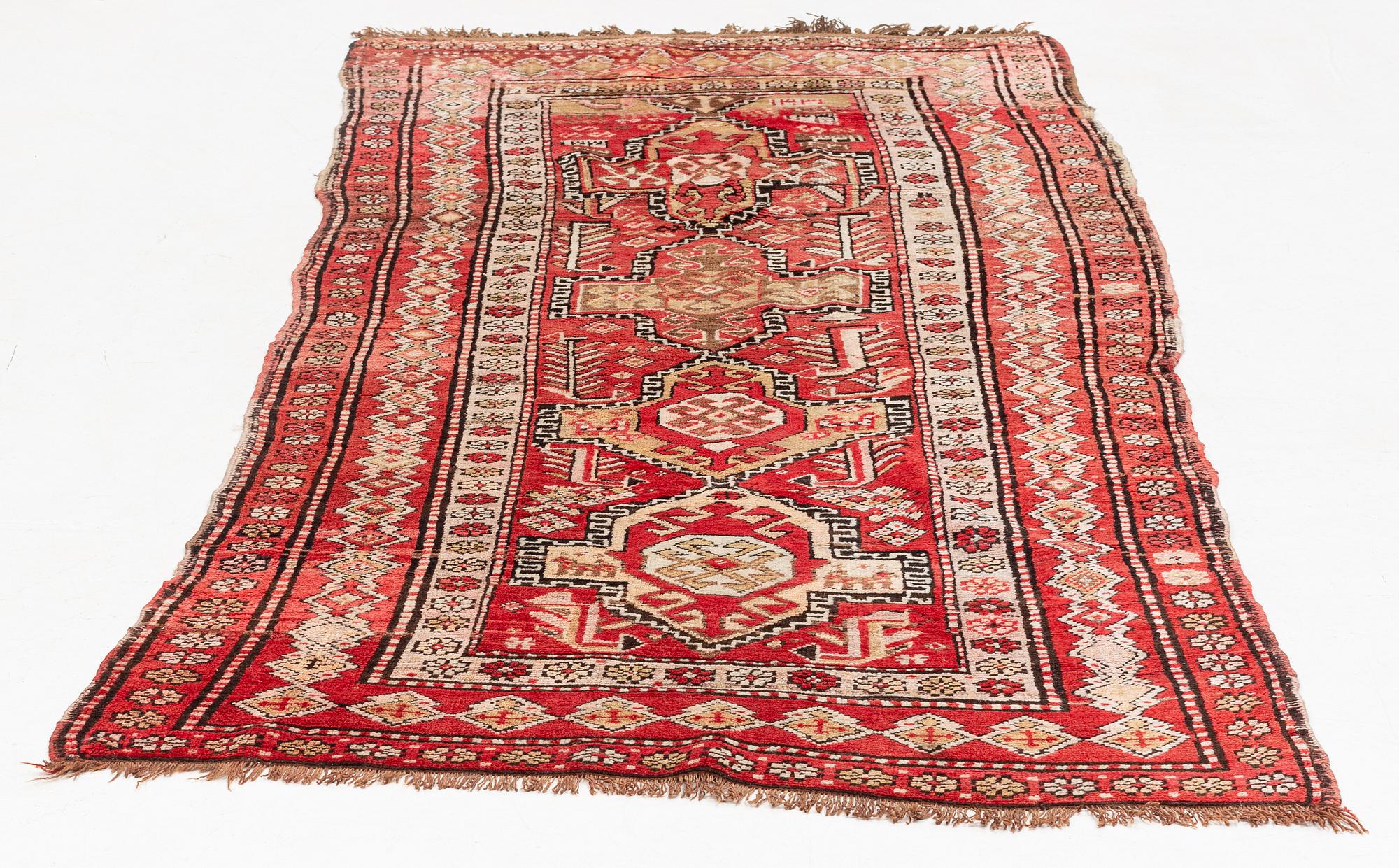 An oriental semi antique carpet, circa 272 x 120 cm.