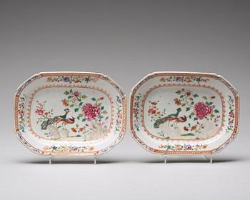 A pair of famille rose 'double peacock' butter tureens with cover and stand, Qing dynasty, Qianlong (1736-95).