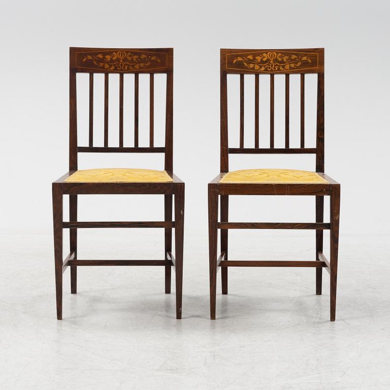 A group of five rosewood veneered chairs and a stool, mid 20th Century.