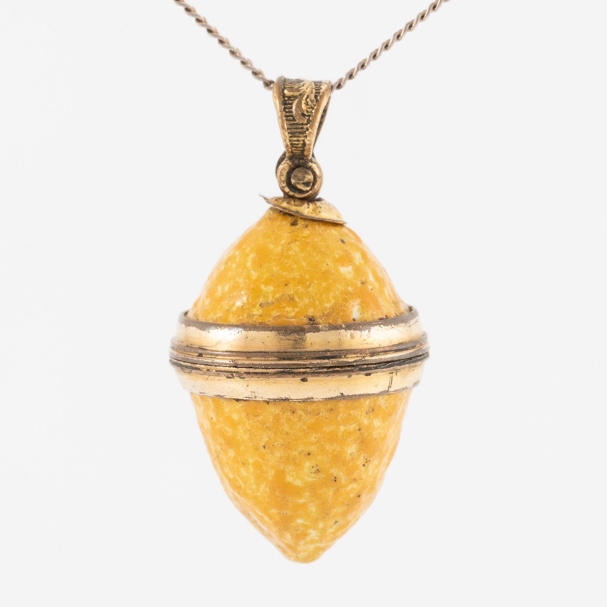 Charm in the form of a lemon with yellow enamel.