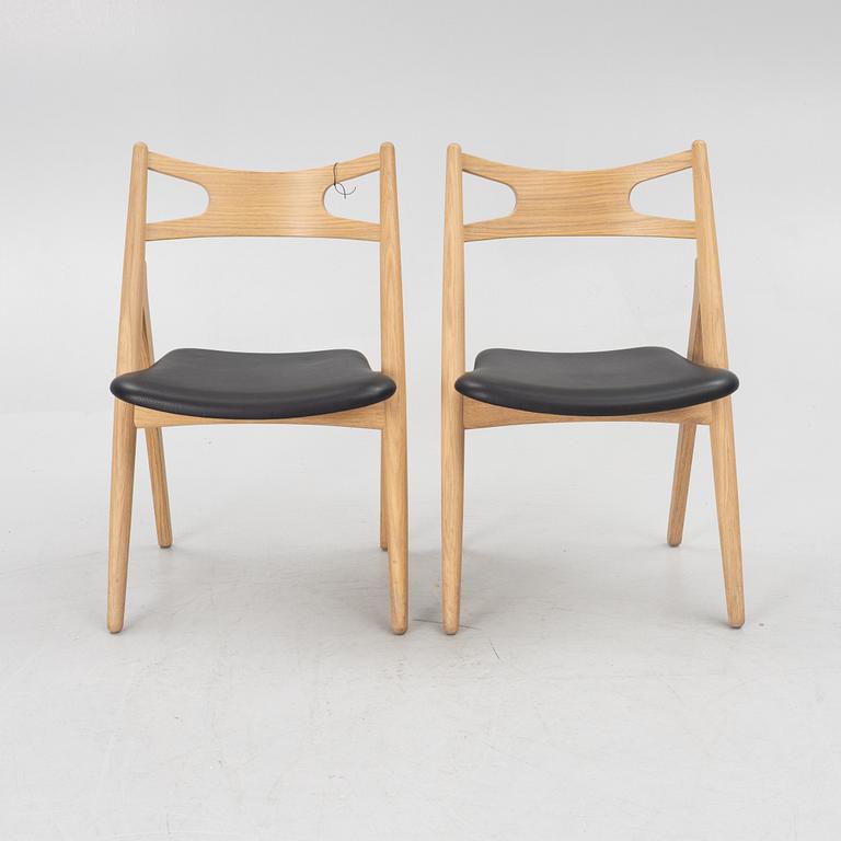 Hans J Wegner, a pair of chairs, model CH 29 "The Savbuk Chair", Carl Hansen.
