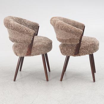 A pair of armchairs, AB Bröderna Biörs Snickerifabrik, mid-20th century.