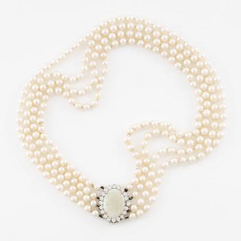 Necklace, four-row with cultured pearls, clasp 18K white gold set with opal and brilliant-cut diamonds.