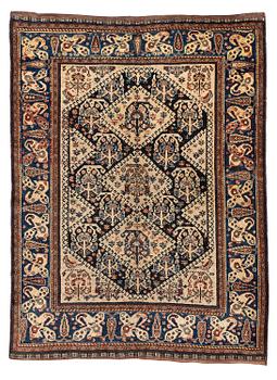 502. An antique Qashqai rug, South Persia, c. 189 x 142 cm.