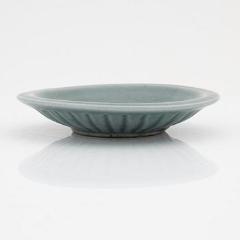 A celadon dish, for the south east asian market, double fish, Mingstyle, 20th Century. And a Chinese sealstone.