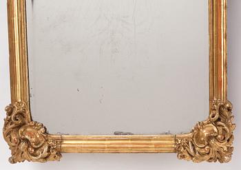 A presumably German giltwood rococo mirror, mid 18th century.