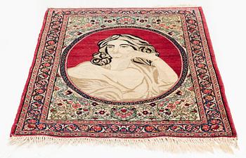 An antique pictoral Kerman Raver rug, c. 87 x 65 cm.