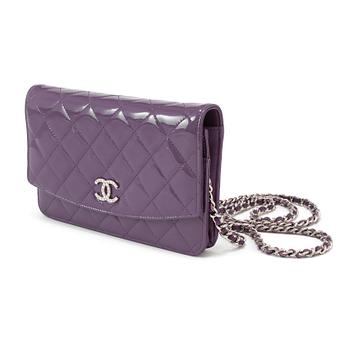 A purple lacquer handbag by Chanel  2011.