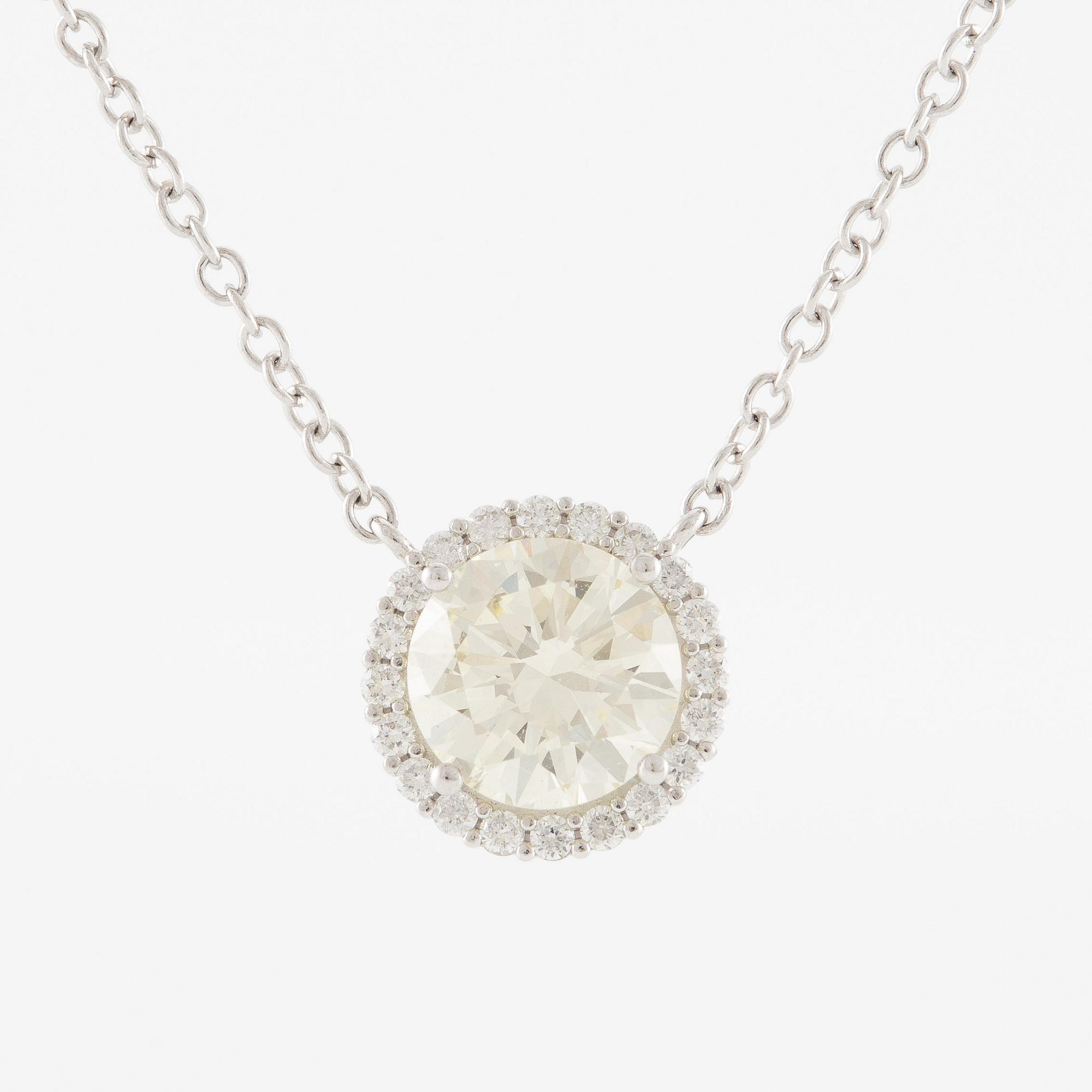 Collier 18K vitguld med briljantslipad diamant.