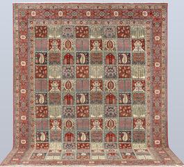 A semi-antique Ghom carpet, approx. 318 x 241 cm.