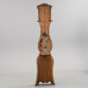 a painted grandfather-clock from the first half of the 19th century.