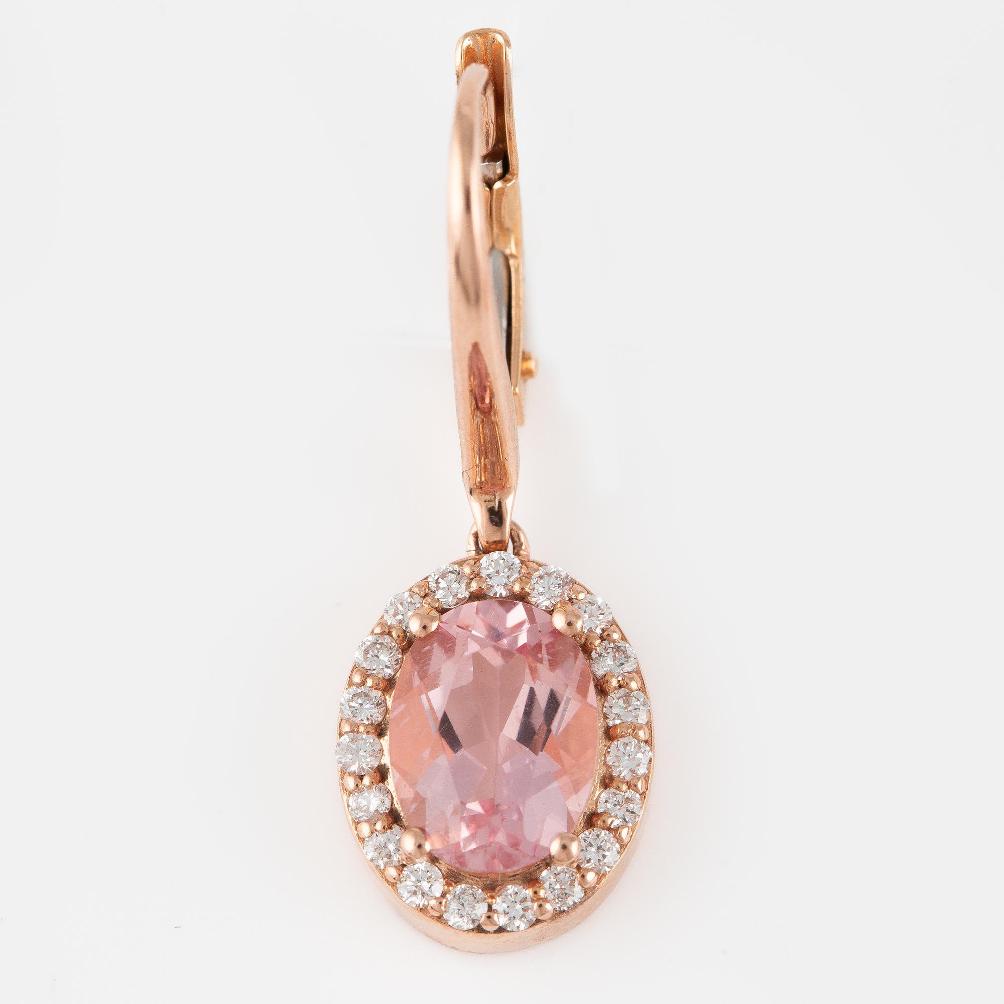 A pair of 14K gold earrings with faceted morganites and round brilliant-cut diamonds.