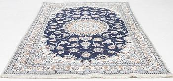 A Nain carpet, c. 255 x 150 cm.