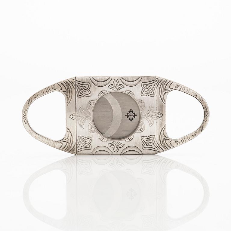 Patek Philippe, sikarileikkuri sekä kotelo.