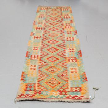 A RUNNER, an Oriental Kilim, ca 421,5 x 80,5 cm.