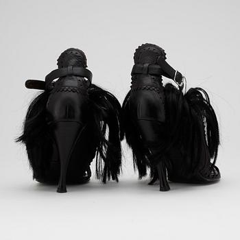 BALENCIAGA, a pair of brown and black leather sandalettes with pony hair.