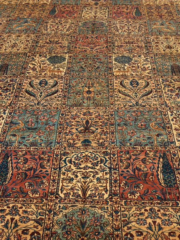 A CARPET. An old Kerman. 521 x 356 cm.