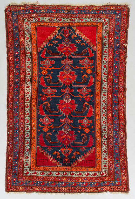 A kazak rug, south caucasus dated, ca. 201 x 135 cm.
