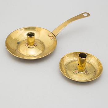 Two 18th century brass candlesticks.