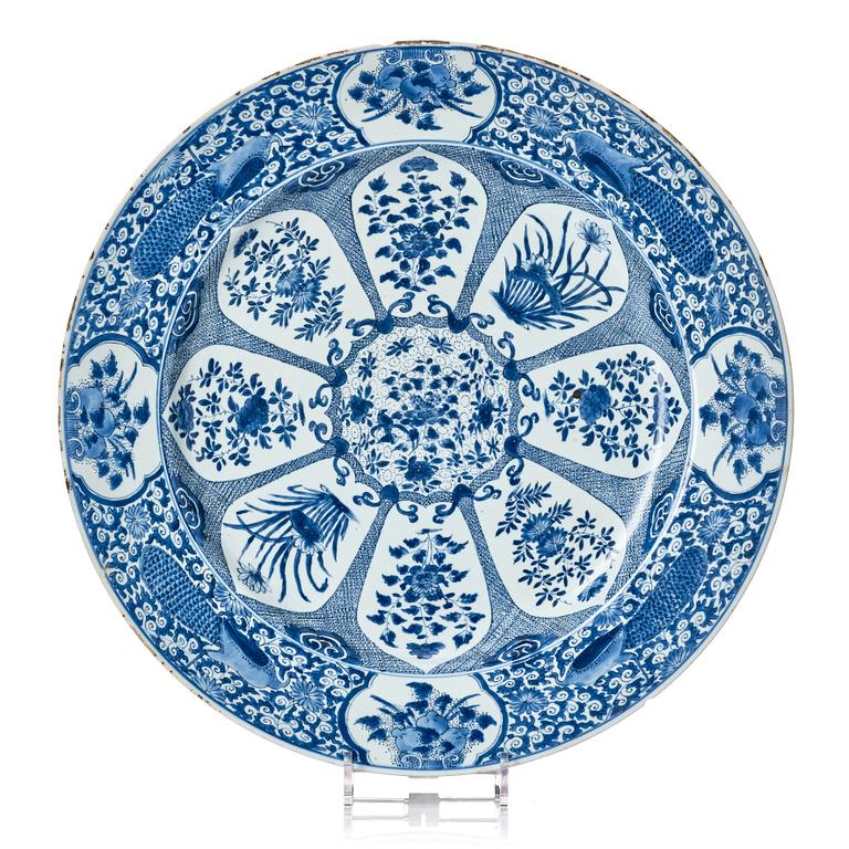 A massive blue and white 'peacock' charger, Qing dynasty, early 18th century.