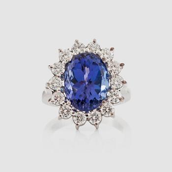 1288. A tanzanite 6.80 cts and brilliant-cut diamond, 1.40 cts G/VS, ring.