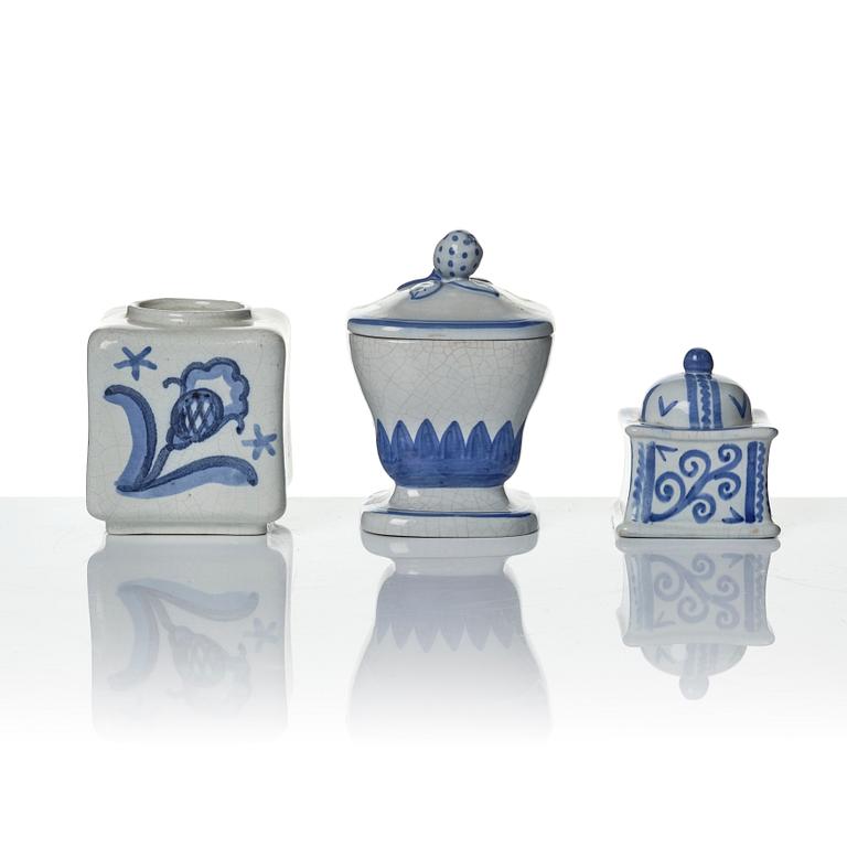 Wilhelm Kåge, eleven pieces of faience including jars, inkwells and a tulip vase, Gustavsberg, Sweden, 1919-1920.