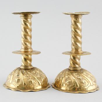 A pair of brass candlesticks, 18th century.