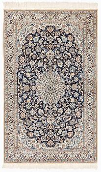 An oriental rug, ca 204 x 126 cm.