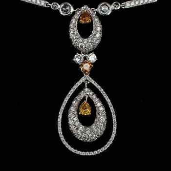 A brilliant cut diamond, and fancy coloured diamond pendant, tot. app. 5.50 cts.
