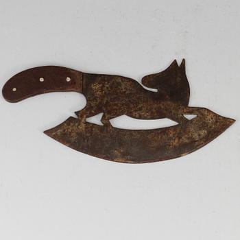 A 19th century iron meat cutter.