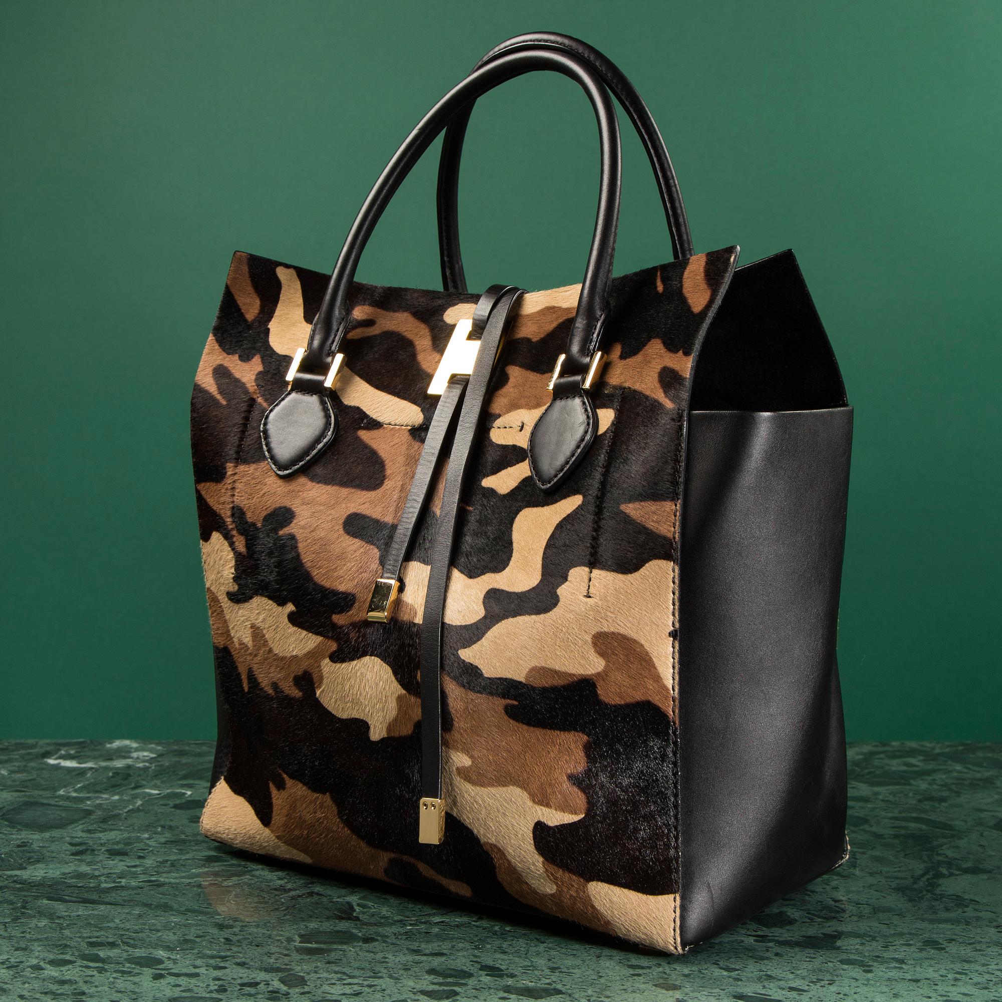 A hand bag by Michel Kors.