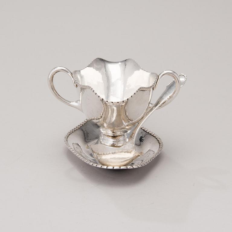 A sauce boat with a sauce ladle in silver, mark of Paul Bang, Copenhagen, Denmark 1929 and 1930s.