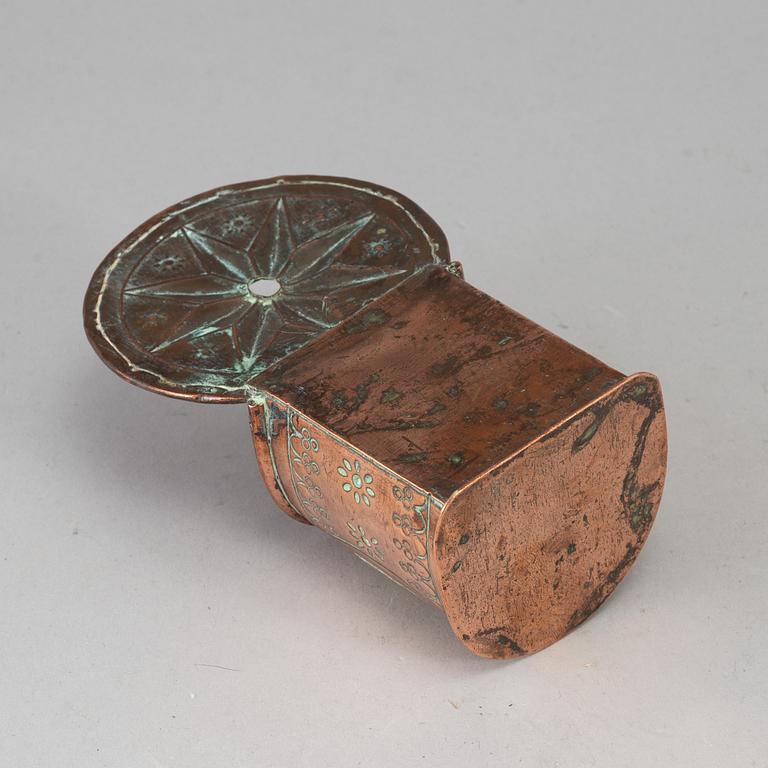 A 19th century brass and copper spoon holder.