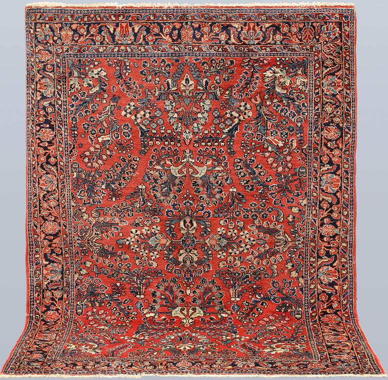 An American Sarouk rug, semi-antique, c. 200 x 142 cm.