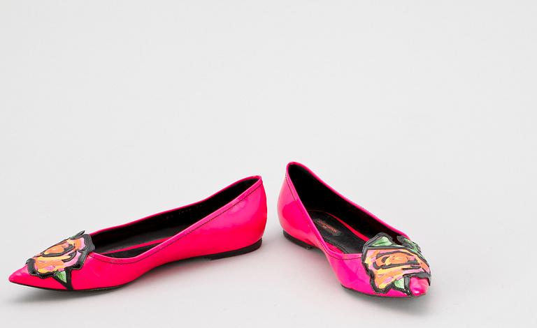 Two pair of shoes by Louis Vuitton.