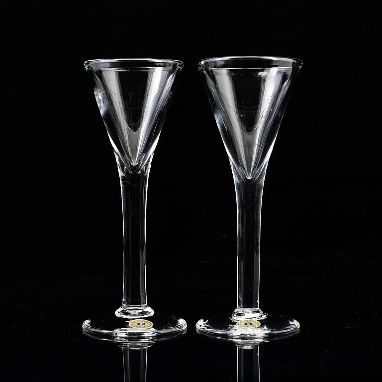 A set of twelve "Antik" shot glasses and two decanters by Reijmyre Glasbruk.