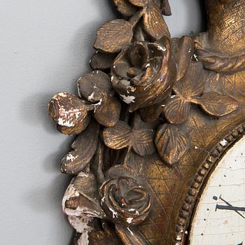 A 18th century wall clock.