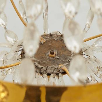 A late Gustavian gilt-brass and cut-glass four-branch chandelier, circa 1800.