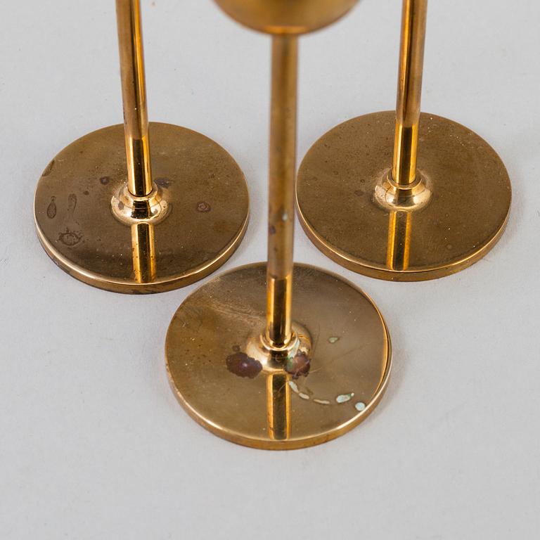 Pierre Forssell, A set of three 'Tulip' brass candlesticks by Skultuna Bruk, 1993.