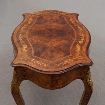 a rococo-style table/desk from England in the late 19th century.