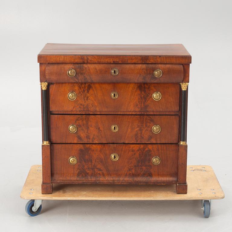 An Empire chest of drawers, first half of the/mid 19th century.