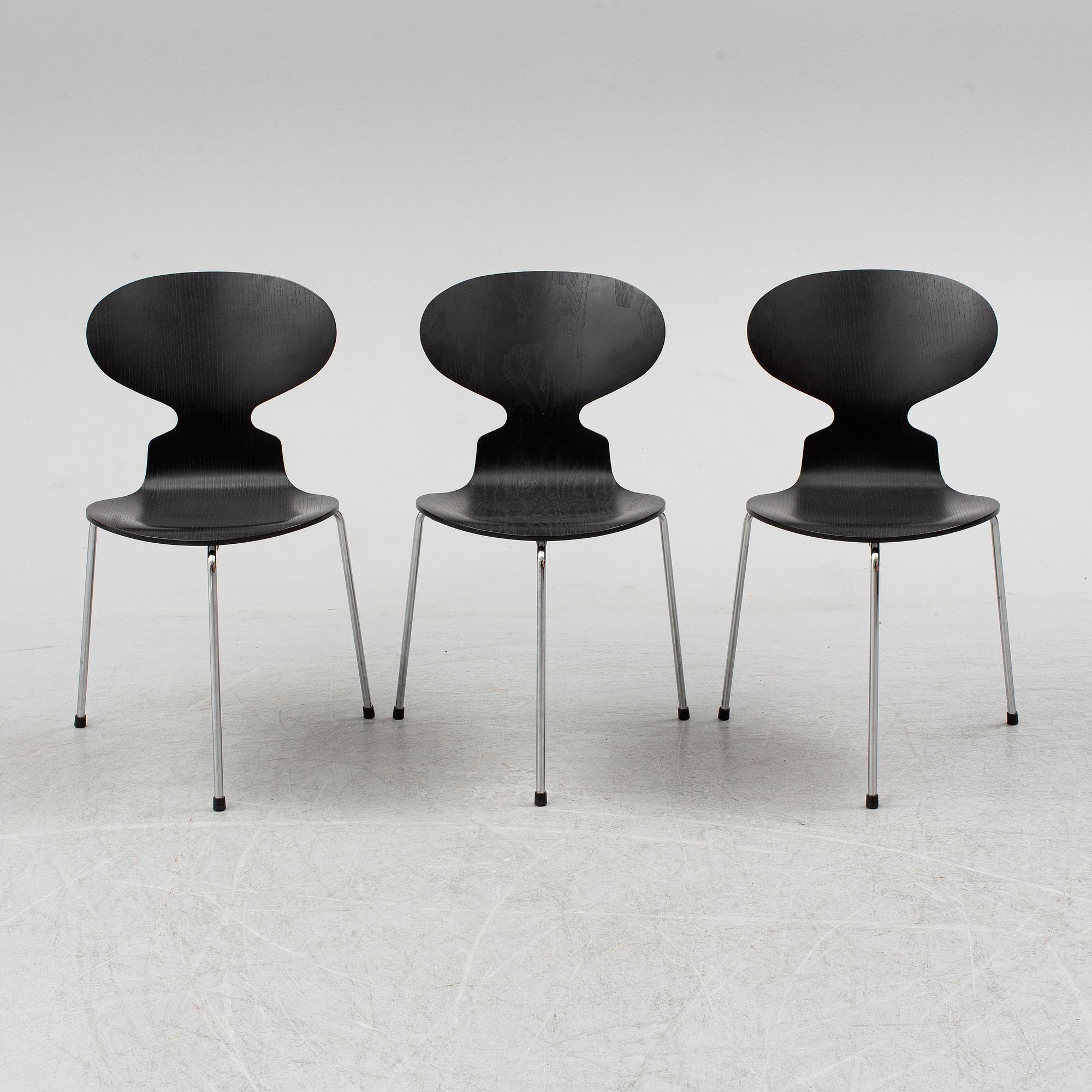 An Arne Jacobsen "Centenary Package" comprising three "Ant Chairs" and an eggshaped table, Fritz Hansen, Denmark.