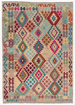 A Kelim rug, c. 252 x 180 cm.