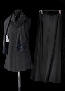A black three-piece 1960s/70s ensemble consisting of trousers, top and scarf by Christian Dior.