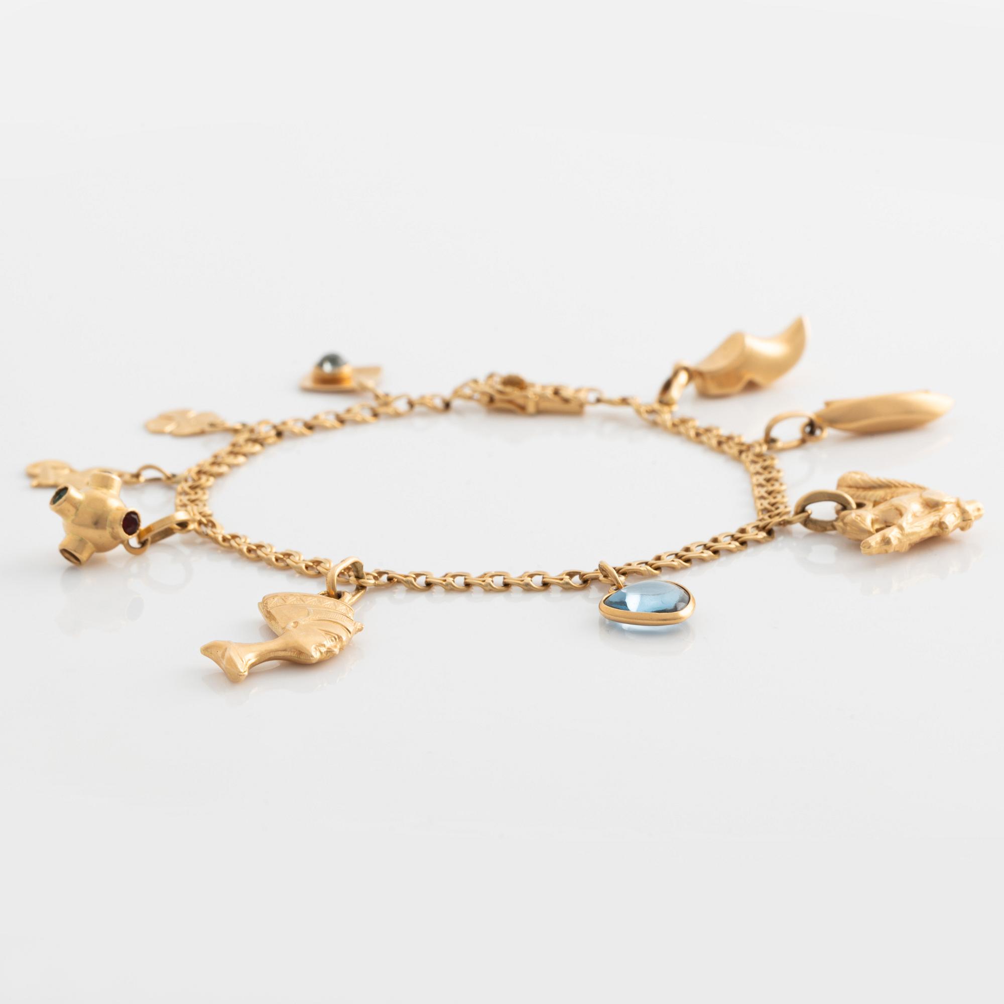 Armband med berlocker 18K guld.